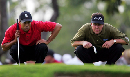 Tiger and Phil putting.