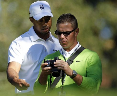 Tiger Woods and Sean Foley watching swings on camera